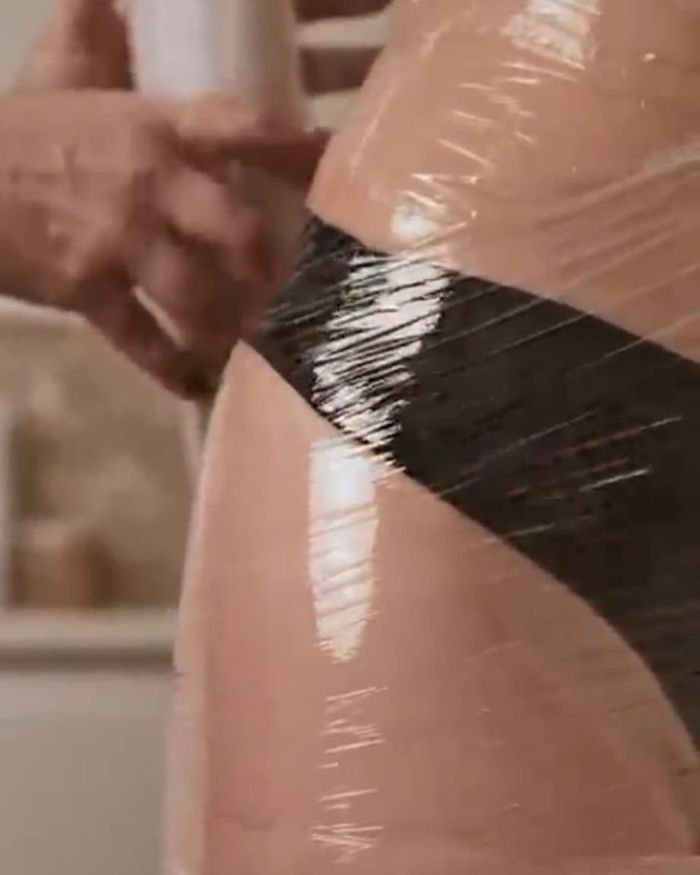 Body wrap treatment applied with brush — part of anti-cellulite therapy at Magic Hands, Hessle, East Yorkshire
